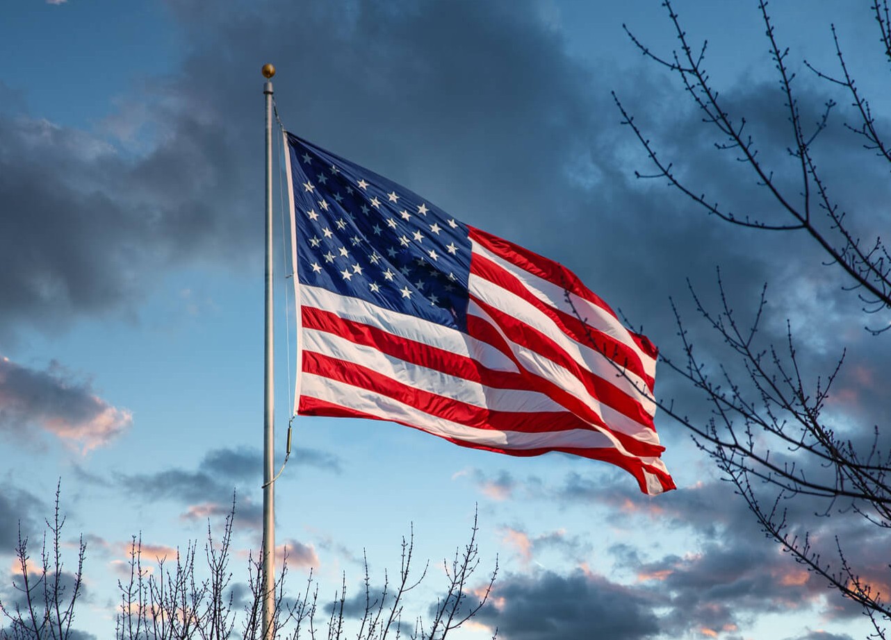 An American flag waving in the sky